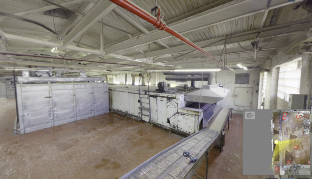 Industrial space with machinery and conveyors.